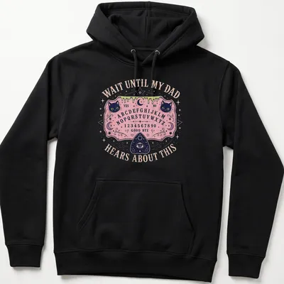 Whimsical T-shirt design featuring Ouija board and playful cats with humorous text. — printed on a unisex hoodie