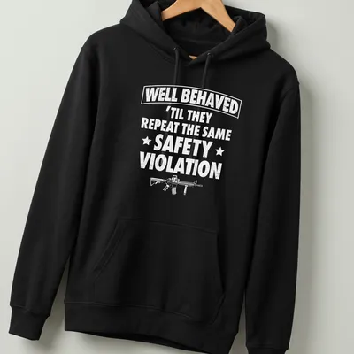 Bold text reading WELL BEHAVED with rifle graphic on a black — printed on a unisex hoodie
