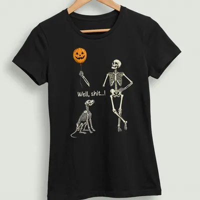 Whimsical skeleton with pumpkin balloon and dog design on — printed on a women's shirt