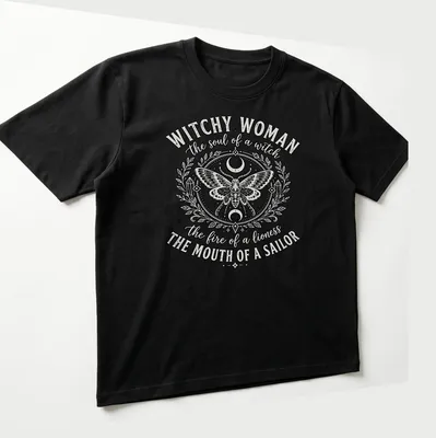 Vintage ornate Witchy Woman shirt featuring a detailed moth and bold text — printed on a unisex t-shirt (angled view)