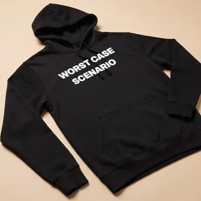 Bold typography shirt stating WORST CASE SCENARIO — printed on a unisex hoodie
