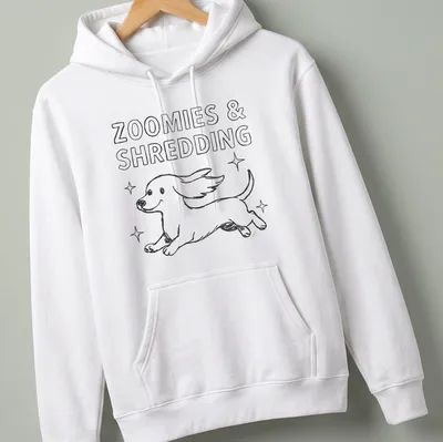 Kawaii line-art Dachshund running with the text 'Zoomies & Shredding' in black and white — printed on a unisex hoodie